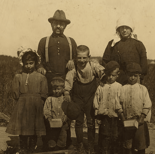 The Arnao family of berry pickers in the fields of Truitt's farm. This is an Italian family coming from Phildelphia and now ready to go to Carmel, N.J. to continue picking. The family consists of: 1 child 3 years of age, 1 child 6 years of age, 2 children 7 years of age, 1 child 9 years of age, 1 child 10 years of age, 1 child 11 years of age. All of whom pick. Location: Cannon, Delaware.