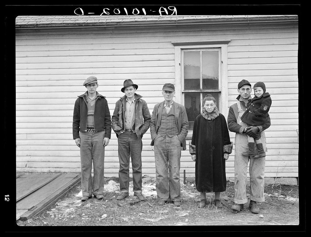 Part of family of Charles H. Mitchell, sixty-three years old. Mitchell has rented farms in the past but, because of inability to get a farm, worked as hired hand. Sons have been able to find but very little work. Family is on unemployment relief in Estherville, Iowa, 1936