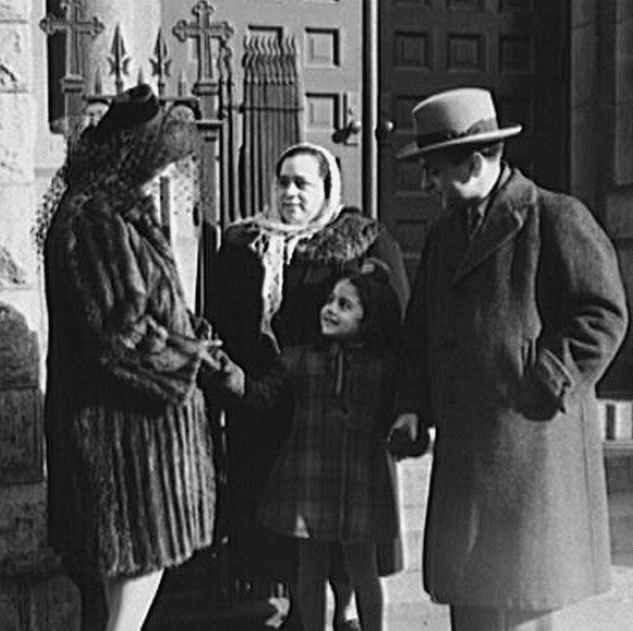 New York, New York. Italian family on the steps of a Catholic church in the Bronx after mass on Sunday